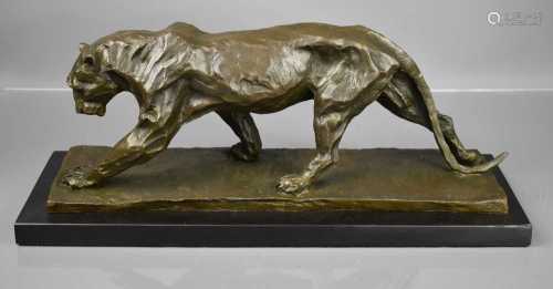 A bronze sculpture of a walking panther in the style of Remb...