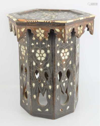 An early 20th century Indian hexagonal table inlaid with mot...