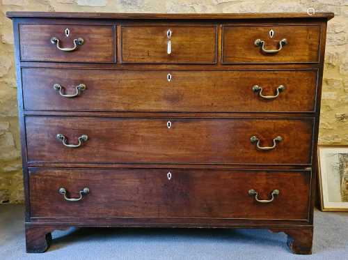 A Georgian mahogany chest of drawers with ivory inlaid keyho...