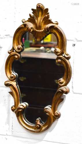 A small 19th century scroll work wall mirror with foliate cr...