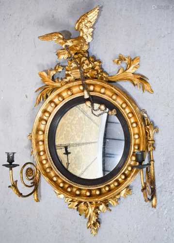 A Regency convex mirror with scrolling arm candle sconces, g...