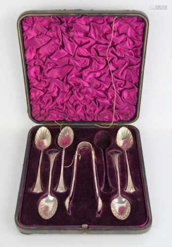 A boxed set of silver spoons and sugar nips, Sheffield 1890,...