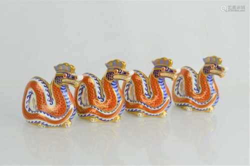 A group of four Royal Crown Derby dragon paperweights11cm hi...