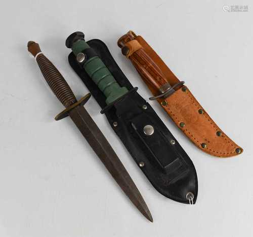 A Mora Swedish knife, a hunting knife and a reproduction Com...