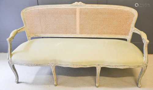 A French 19th century style settee, the caned back with flor...