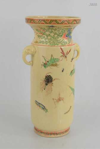 A Japanese vase of cylindrical form, with elephant handle, t...