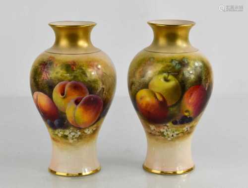 A pair of Royal Worcester vases by Rickets, painted with app...