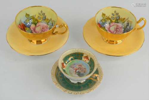 A pair of Aynsley handpainted cups and saucers signed by J.A...