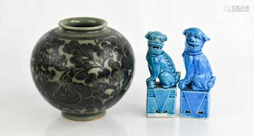 Two blue glazed pottery Chinese dogs of fo, together with a ...