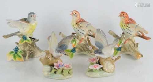 A group of porcelain bird figures to include two Lladro exam...