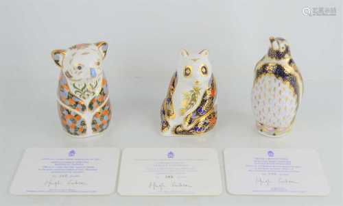 A group of three Royal Crown Derby Endangered Species paperw...