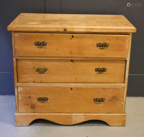 An antique pine chest of three drawers82cm by 90cm by 44cm
