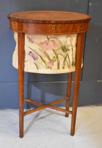 A 19th century satinwood oval sewing table, with tapestry ba...