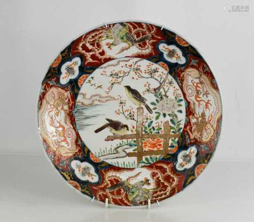 A 19th century Japanese charger, with enamelled polychrome d...