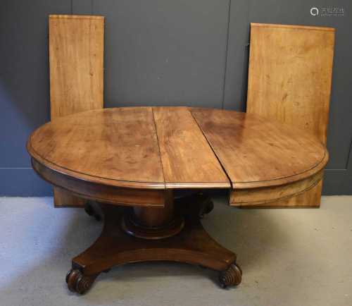 A Victorian mahogany extending pedastal dining table with th...