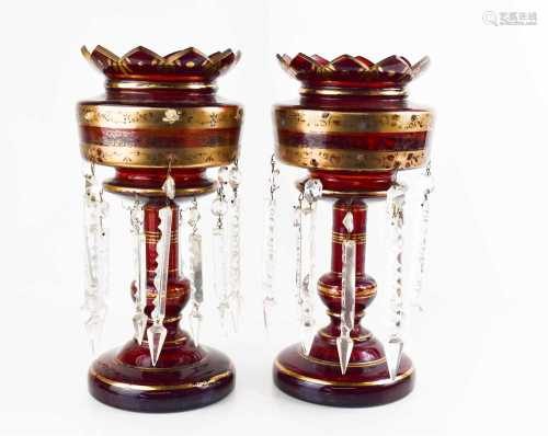 A pair of Victorian ruby glass lustres, with gilt floral dec...