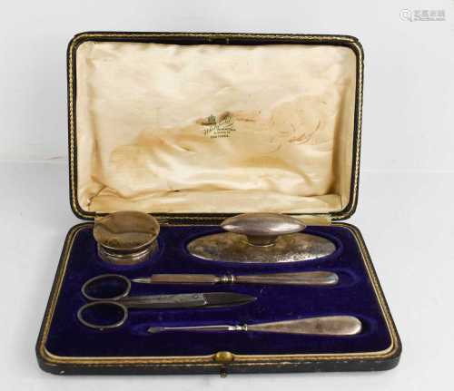 An Edwardian silver manicure set, Birmingham 1910, in the or...