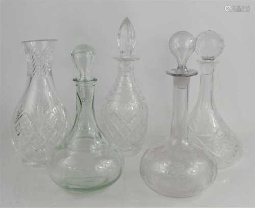 A Royal Brierley vase, together with four various decanters,...