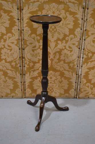 A 19th century mahogany torchere, the reeded baluster stem w...