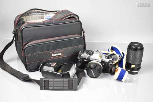 An Olympus CM10 35mm camera and flash in a carry case