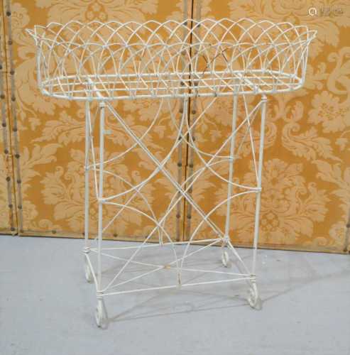 A cream painted wirework plant stand, 74 by 30 by 78cm high.