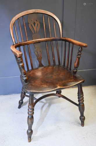 A 20th century yew wood Windsor chair, with crinoline stretc...