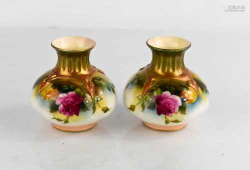A pair of Royal Worcester vases painted with roses, circa 19...