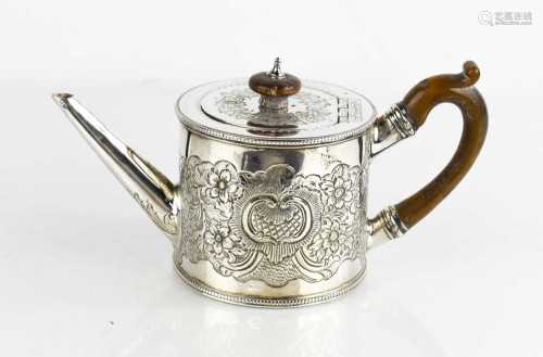 An 18th century George III teapot with foliate embossed deco...