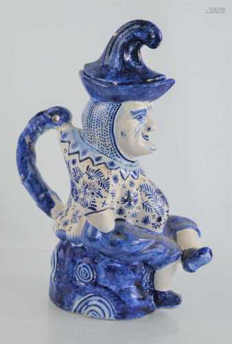 A 19th century Dutch Delft blue and white character jug of M...