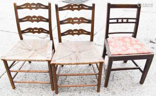 Two early 19th century ladder back chairs with rush seats to...