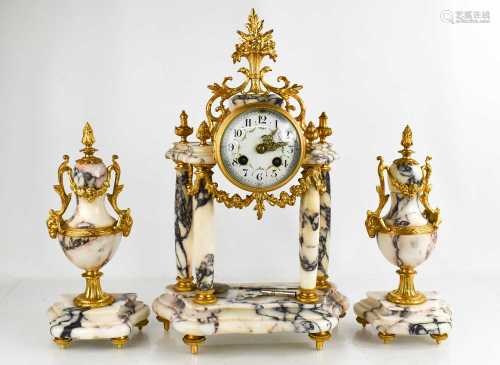 A 19th century French marble and gilt clock garniture, the d...