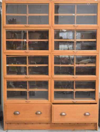 A large Haberdashery shop display cabinet with lift up doors...
