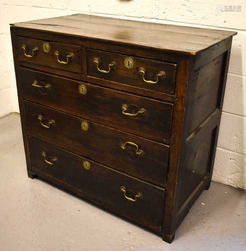 An 18th century oak chest of drawers with planked top and tw...