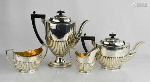 A silver tea service, Sheffield 1910, comprising tea pot, ho...