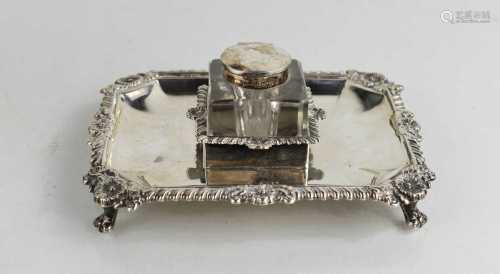 An Edwardian silver desk stand set with a glass inkwell, the...
