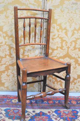 A 19th century oak country spindle back chair, with turned l...