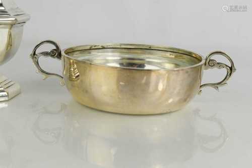 A silver sifter, together with a silver shallow bowl with tw...