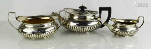 A George III three piece silver tea set comprising tea pot, ...