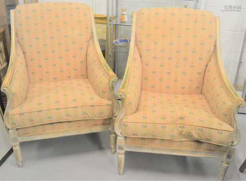 A pair of 20th century French armchairs, with painted and gi...
