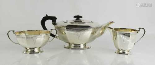 A silver Art Deco tea set, comprising teapot, sugar bowl and...