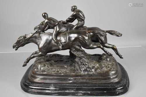 A 20th century bronze sculpture, two racehorses & jockeys ju...