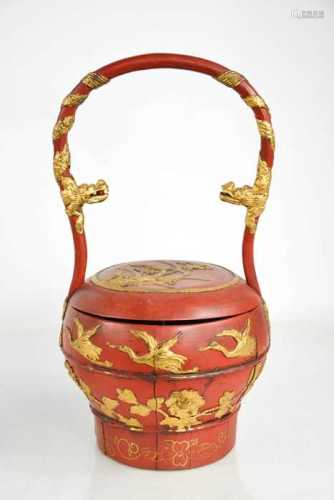A Chinese red lacquered wedding handbag circa 1900, with car...