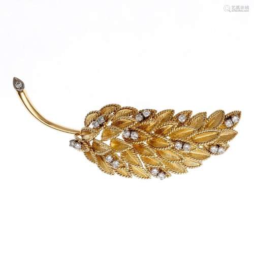 Leaf-shaped gold and diamonds brooch.