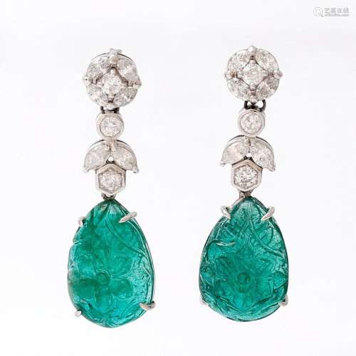 Long emerald and diamond earrings.