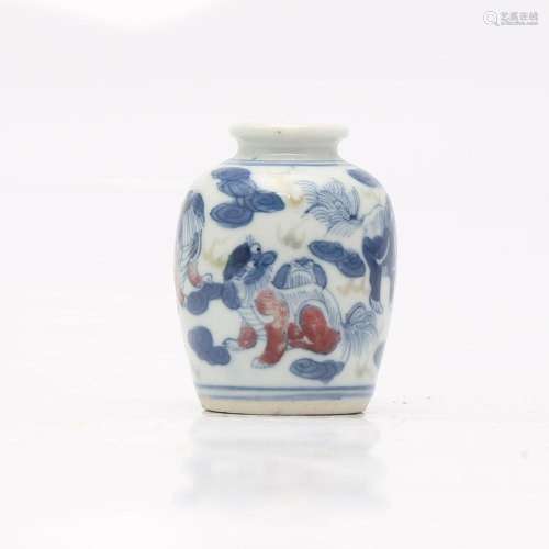 Small Chinese vase in blue and white porcelain with red deco...