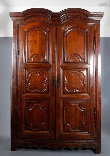 French walnut wardrobe with carved panels, 18th Century.