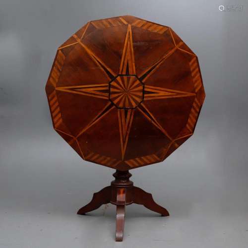 English tilt-top table in rosewood and satin wood, 19th cent...