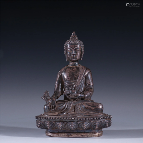 A Silver Buddha Statue