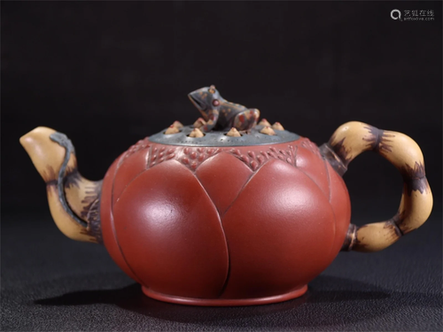 A Carved Yixing Zisha Lotus Patterned Teapot