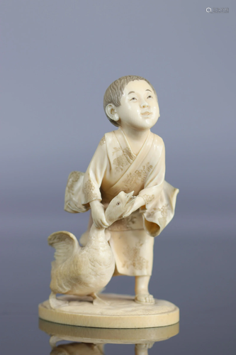 Japan Okimono carved of a young boy with a goose 19th